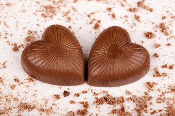Two chocolate hearts with crumbs