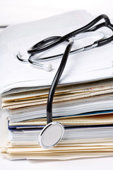 stethoscope on the stack of paper