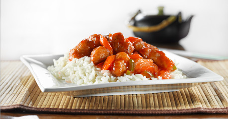 sweet and sour pork on rice wide shot