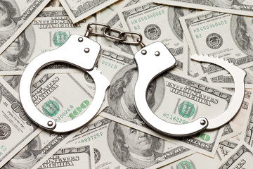 Handcuffs on dollar currency