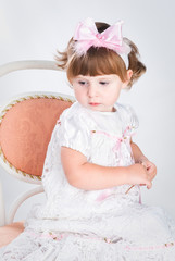 Fototapeta premium alone cute girl on the chair wearing retro dress