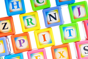 Learning and education concept - pile of alphabet blocks