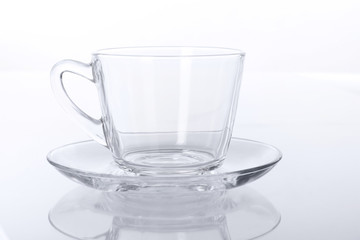 Transparent glass cup and saucer