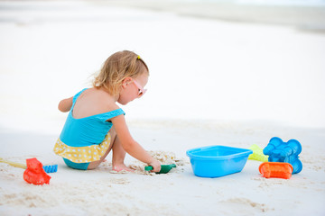 Little girl playing at beach