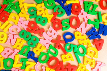 Children letters and digits on the table