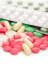 Fototapeta na wymiar Heap of pills isolated on white background
