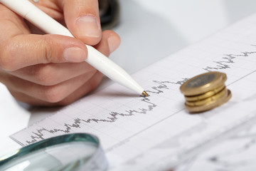woman’s hand holding a pen