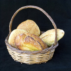 corn flour bread in a basket, black background