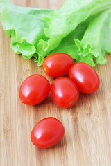Ripe tomatoes  on a chopping board