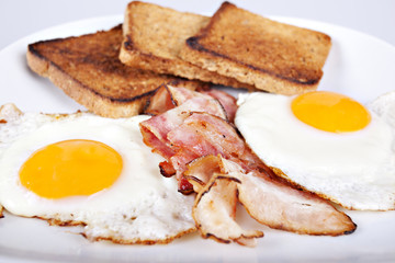 Breakfast - toasts, eggs, bacon
