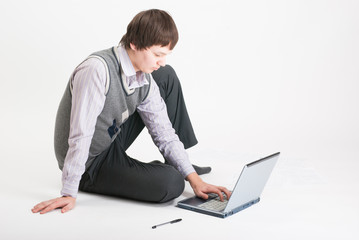 The business man with the laptop on a white background
