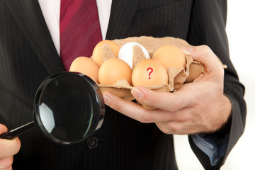 businessman with egg in the hands