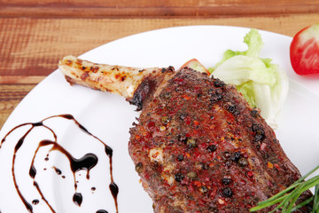 plate on wood : grilled shoulder