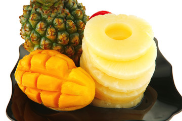 raw fruits on black plate