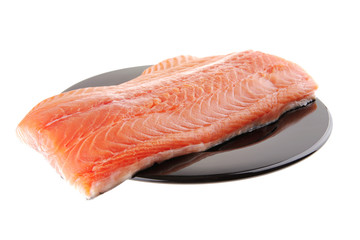 fresh raw salmon fillet on black
