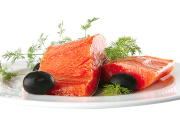 smoked salmon on white plate with olives