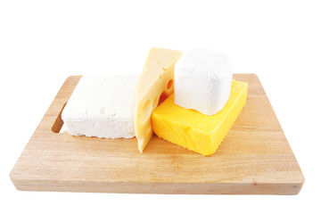 cheeses on wooden board