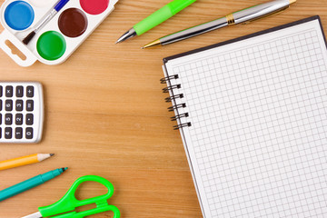 school accessories and notebook on wood table