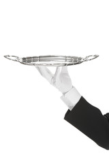 A hand holding a silver tray