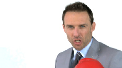 Angry businessman with boxing gloves - Powered by Adobe