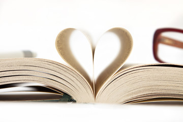 Heart from book pages, isolated  in white