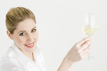 portrait of young woman with a glass of white wine