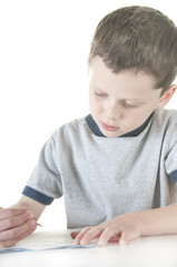 Naklejka premium young boy working at school