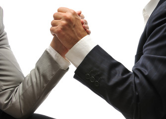 Side view of  businessman and businesswoman arm wrestling.