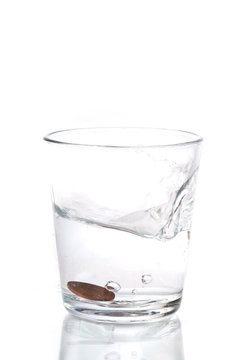 Glass of water with a coin