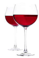 Two Glasses of red wine over white background