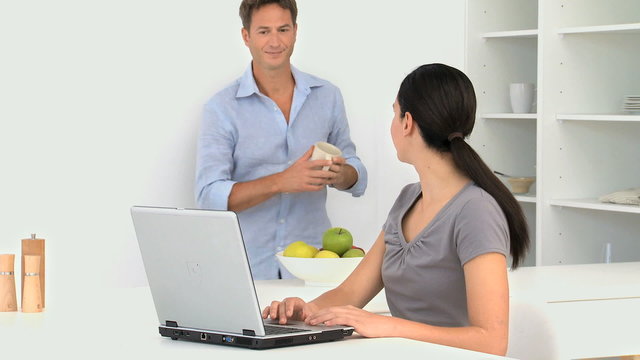 Woman Showing Her Boyfriend Something On Her Laptop