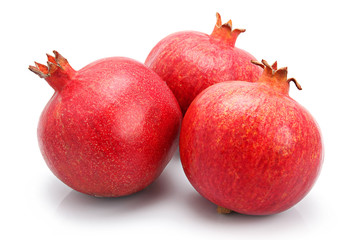 Three pomegranate fruits isolated