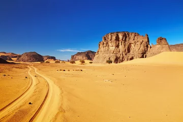 Tuinposter Road in Sahara Desert, Tadrart, Algeria © Dmitry Pichugin
