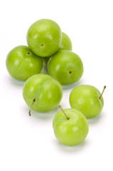 green plums on white