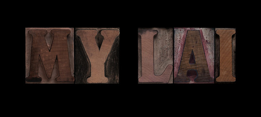 the words My Lai in old letterpress wood type