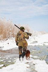 Hunter and his dog waiting for the hunting party to begin