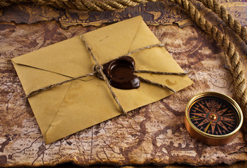 compass and an old letter on grunge background