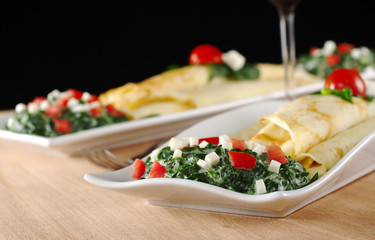 Crepes with spinach, tomato and cheese