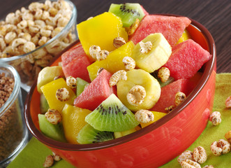 Fruit salad (banana, kiwi, watermelon, mango) with cereals