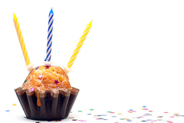 Birthday cupcake with three candles isolated on white