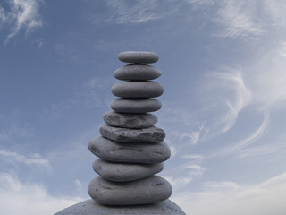 Pebbles stacked over the sky