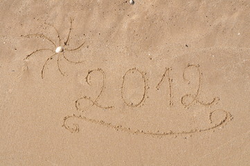 Year 2012 on the beach sand