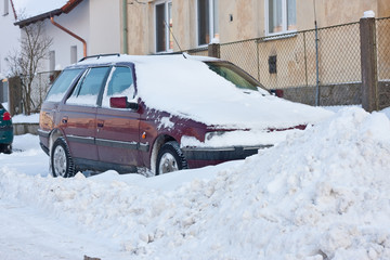 car under winter snow