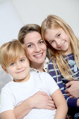 portrait of happy mother with 2 blond children