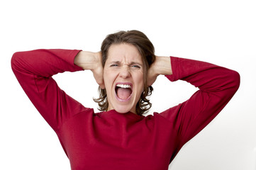 woman yelling holding her ears