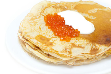 pancakes with caviar and sour cream against white background