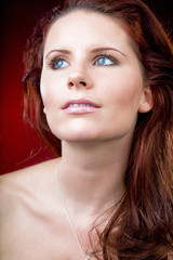 Attractive woman with long red hair.