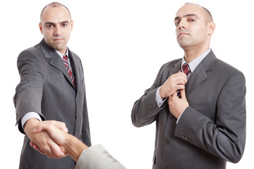 man shaking hand and straighten his tie