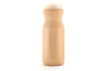 milk(tea taste) in a plastic bottle on a white background