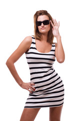 Beautiful girl with glasses posing in studio